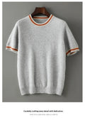 Men's short sleeve pure wool sweater in grey, showing round neck and pullover style on a middle-aged model.