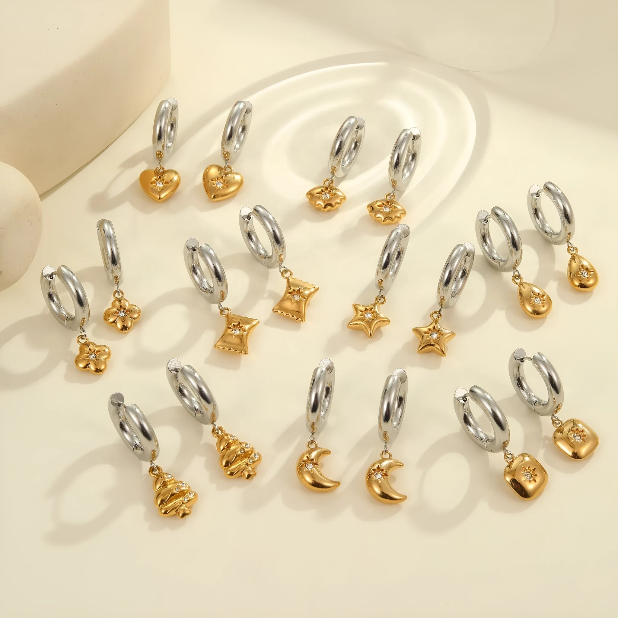Christmas Tree Heart Earrings in stainless steel with 18K gold electroplating showing heart and star geometric designs