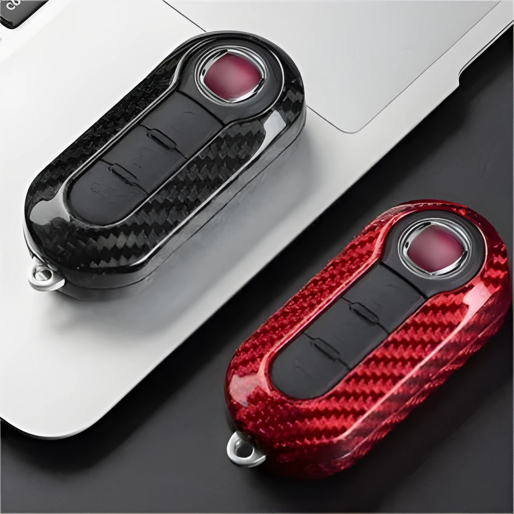 Carbon fibre and glass fibre replacement shell for a car key fob in black, red, and silver black finishes.