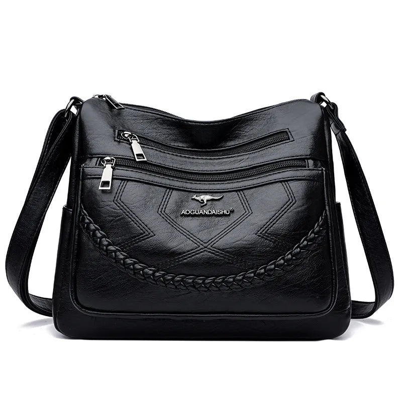 Soft black PU leather women's crossbody bag showing square shape and outer pocket