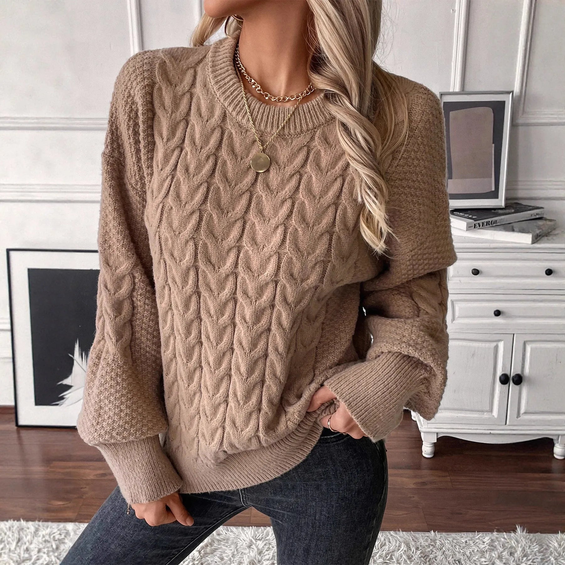 Women's beige casual sweater with twist detail and round neckline on hanger