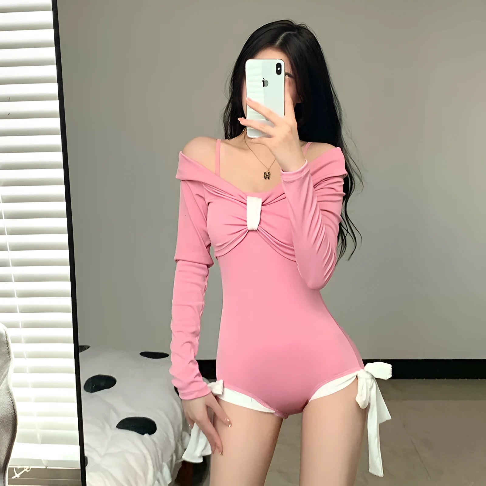 Women's long sleeve one-piece swimsuit in polyester available in pink or black colours