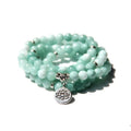 Natural stone ladies bracelet with geometric angel echeveria and lotus design on a wrist.