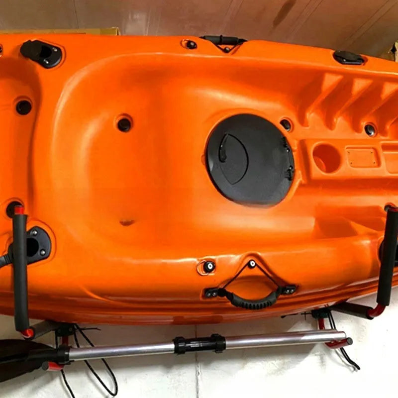 Carbon steel kayak and surfboard wall storage rack mounted on a wall