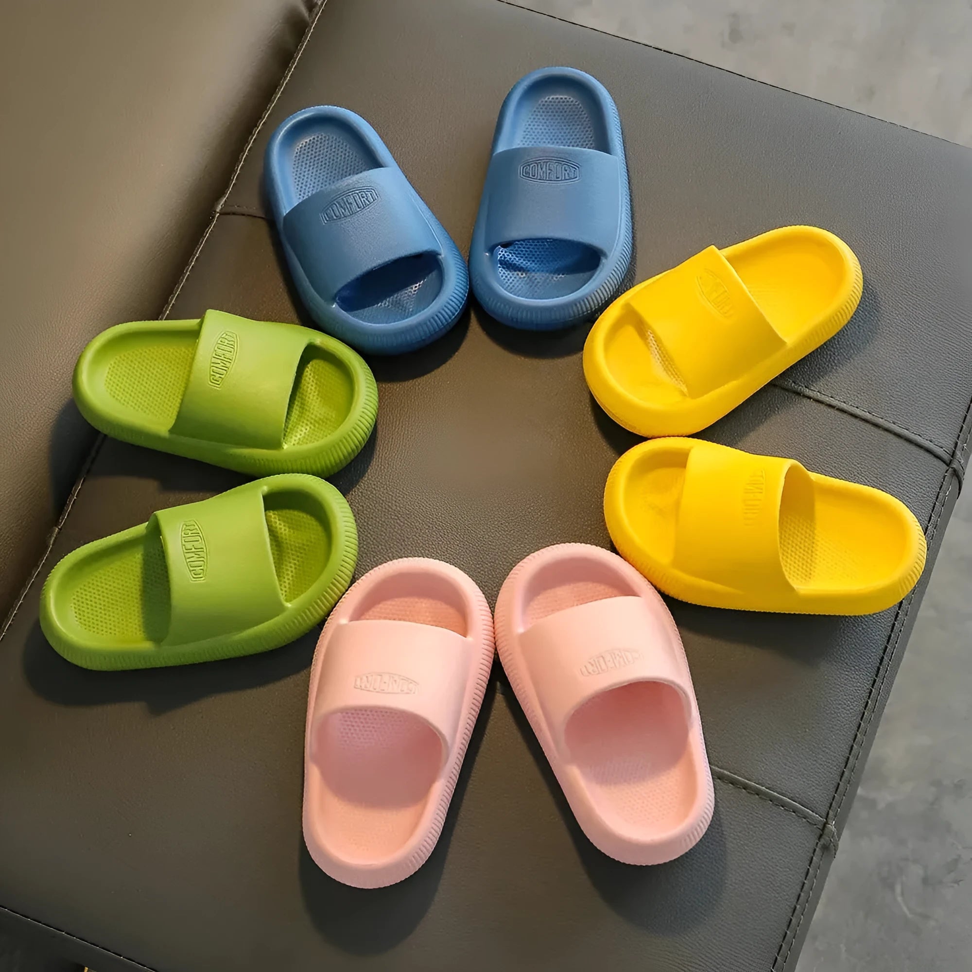Children's EVA slippers in bright colours with non-slip soles showing size range options