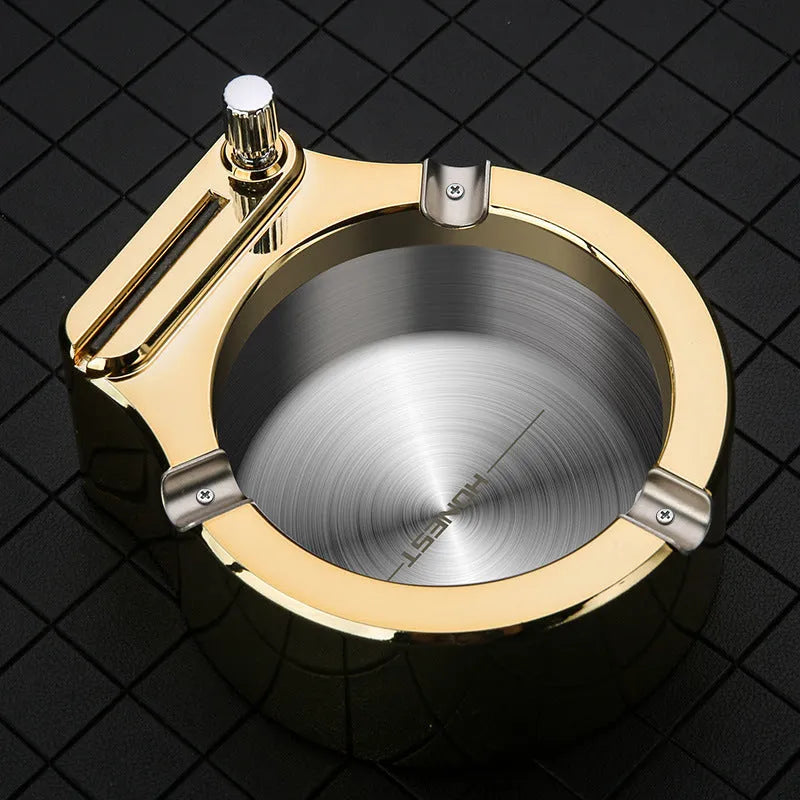 Blue metal ashtray with sliding permanent match lighter and three cigarette slots on a table.