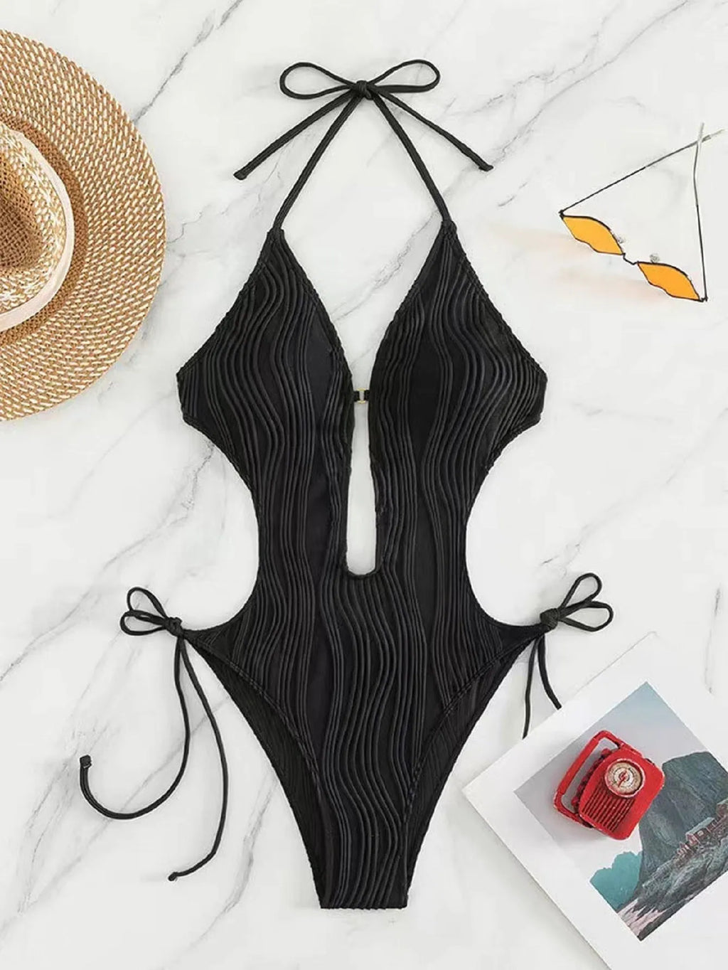 Women's black lace-up triangle bikini made from quick-dry polyester fabric.