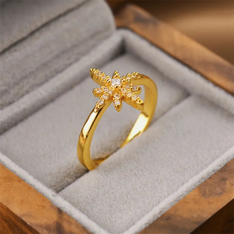 Gold geometric open ring on a model's hand, showcasing Korean fashion style.