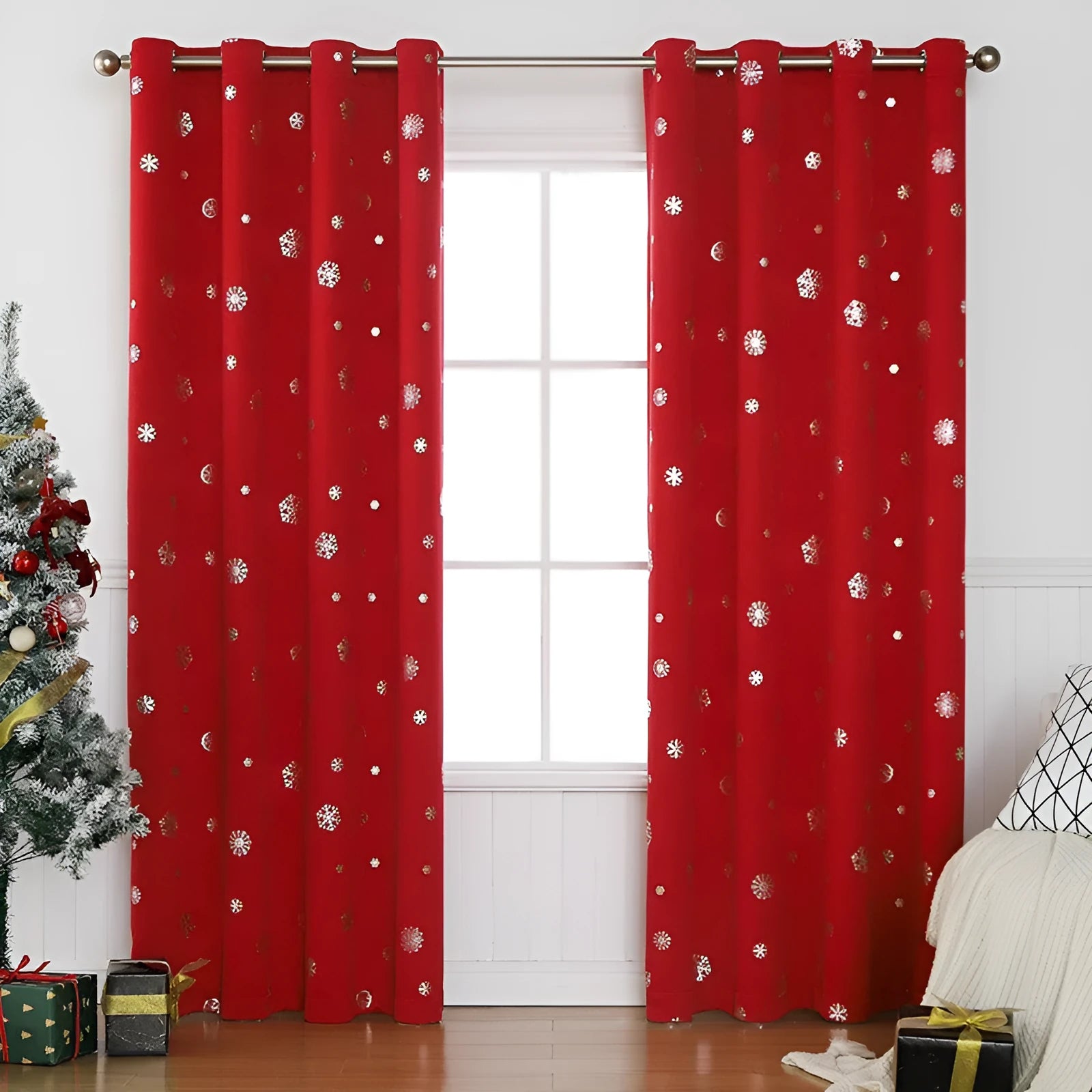 Red polyester snowflake pattern shade cloth curtain with lace loops hanging in modern interior setting