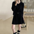 Women's grey knitted cardigan and pleated vest skirt two-piece set with a belt.