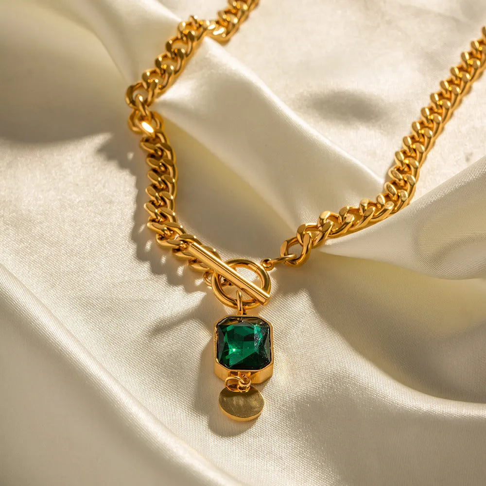 Gold retro pendant necklace with geometric round design and emerald zircon stone