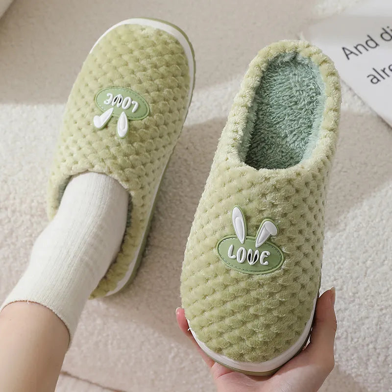 Women's plush rabbit plaid house slippers with thick rubber non-slip soles in apricot colour.