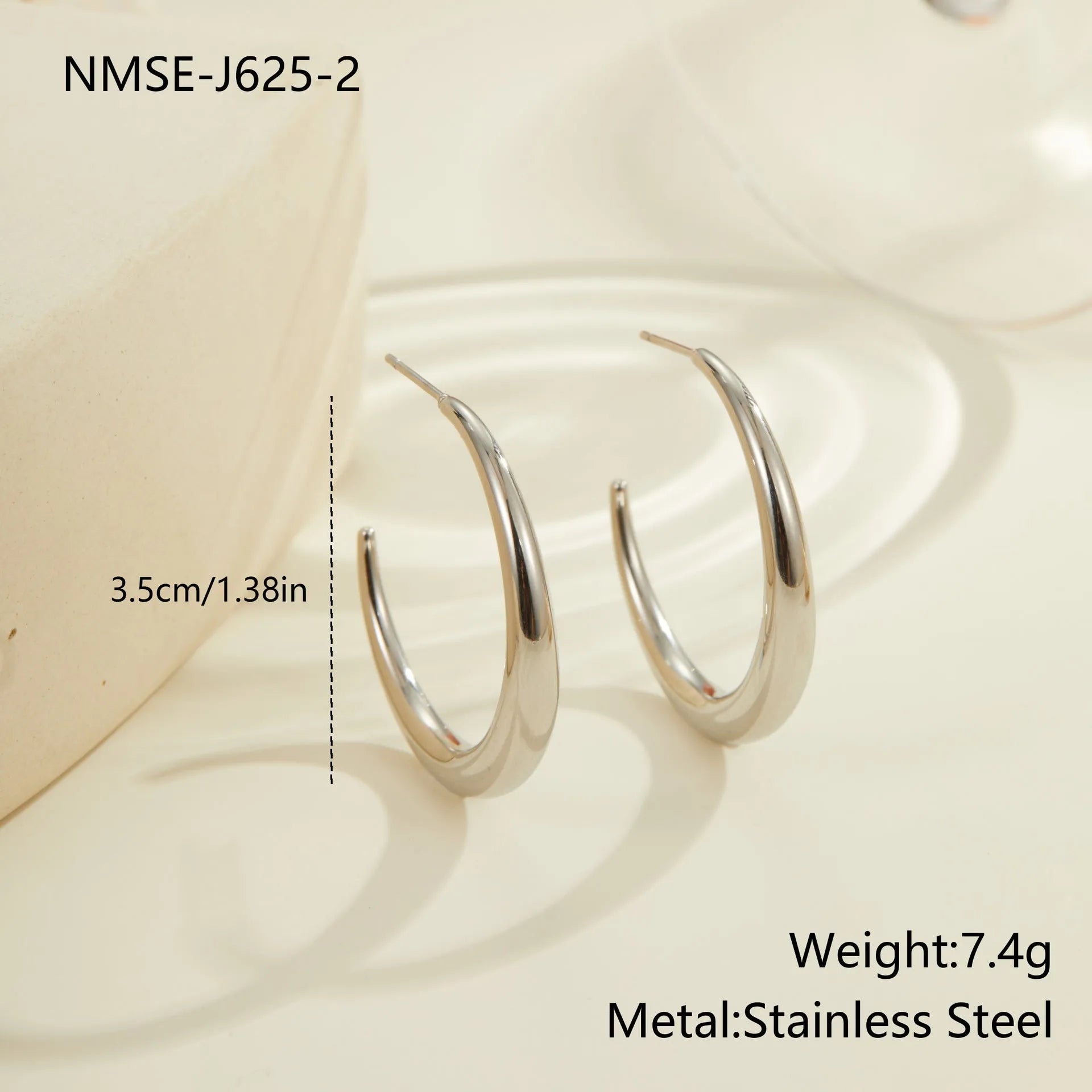 Titanium steel hoop earrings in geometric round design with gold and steel finish options