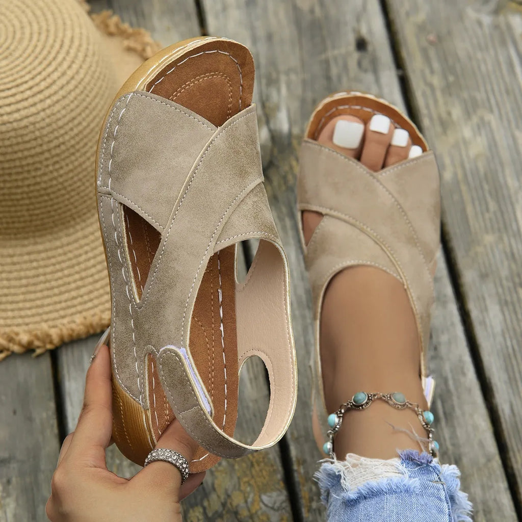 Roman platform sandals with a removable skirt and Velcro strap in a khaki colour.