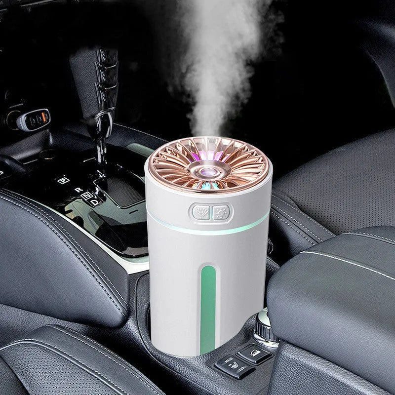 Black USB rechargeable ultrasonic humidifier with LED lights on a car cup holder