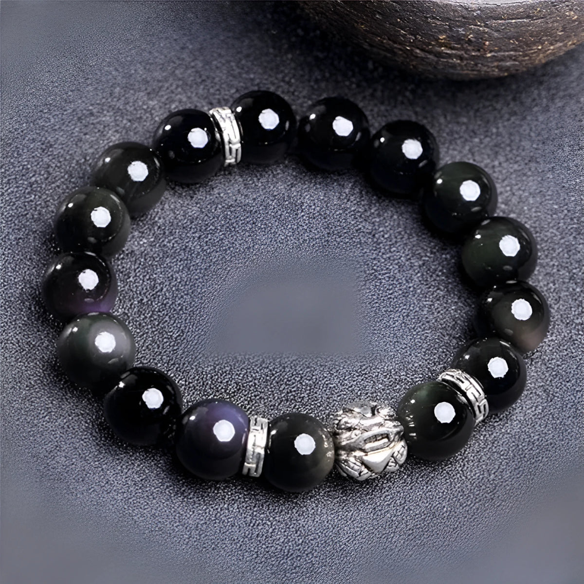 Natural obsidian and 999 silver bracelet with traditional design in two sizes: 10mm female and 12mm male