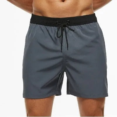 Men's blue athletic shorts with stitching waistband headband pocket and drawstring closure