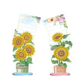 Diamond painting decorative note clip with frameless handmade American craft design on a desktop.