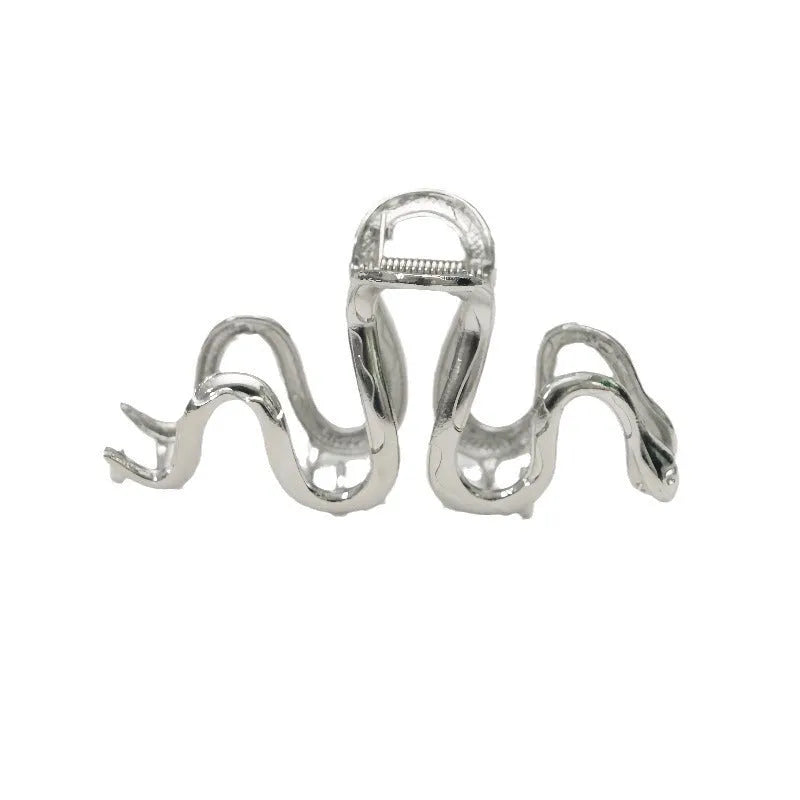 Silver metal hair barrette with a detailed Slytherin snake design, measuring 10.5 cm in length.