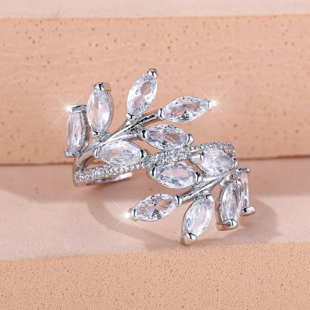 Adjustable copper leaf ring with zircon stones in multiple colour options including sapphire blue and white diamond