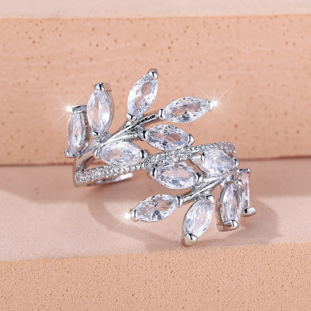 Adjustable copper leaf ring with zircon stones in multiple colour options including sapphire blue and white diamond