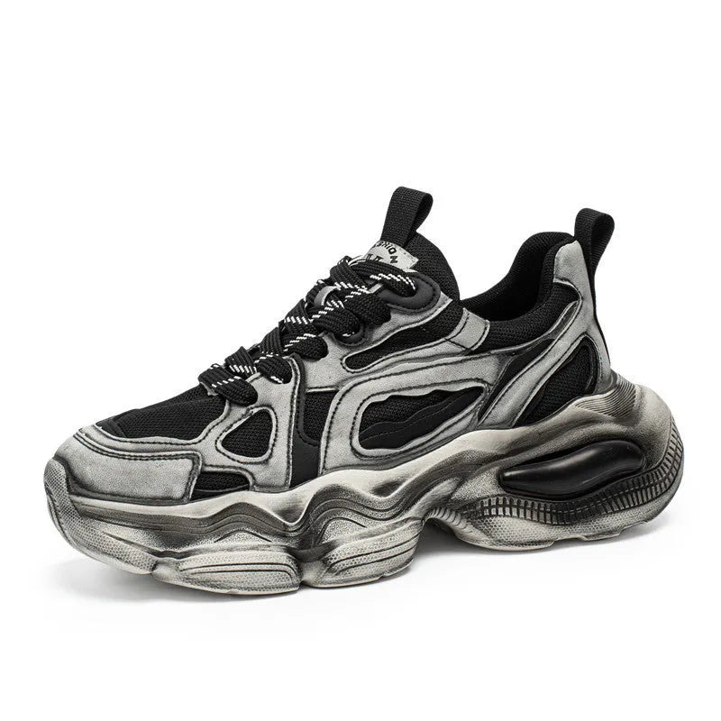 Men's black mesh platform sneakers with a rubber sole and front lace-up closure on a white background.