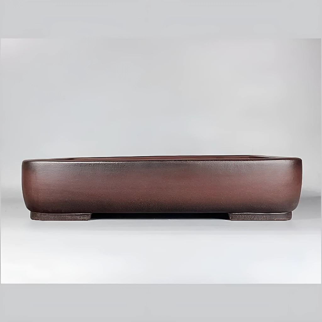 Handmade antique rectangular purple clay flower pot showing traditional ceramic texture