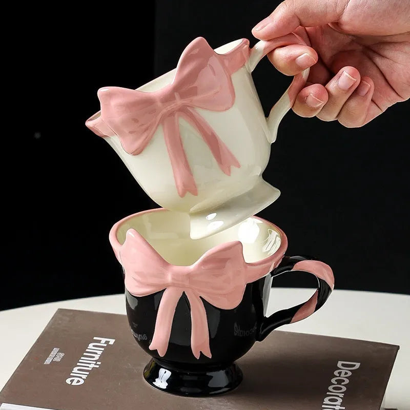 Ceramic mug with heart bow design in black pink or white powder colour, 301-400ml capacity
