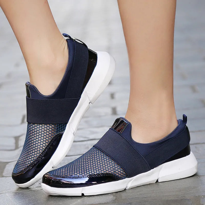 Women's lightweight sneakers with mesh interior in blue, black, and grey colours showing low-cut design