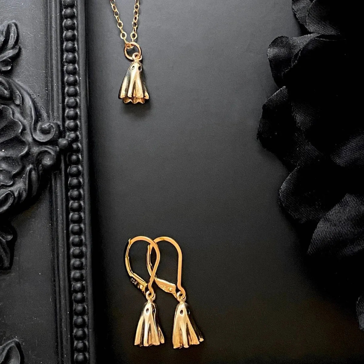 Ghost pendant necklace on a stainless steel chain with choice of cable, Figaro, or mini staple style.