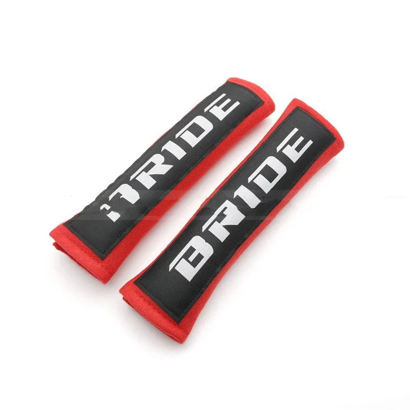 Cotton sponge cloth car seat belt shoulder pads in black, blue, and red colours, showing embroidered weaving detail.