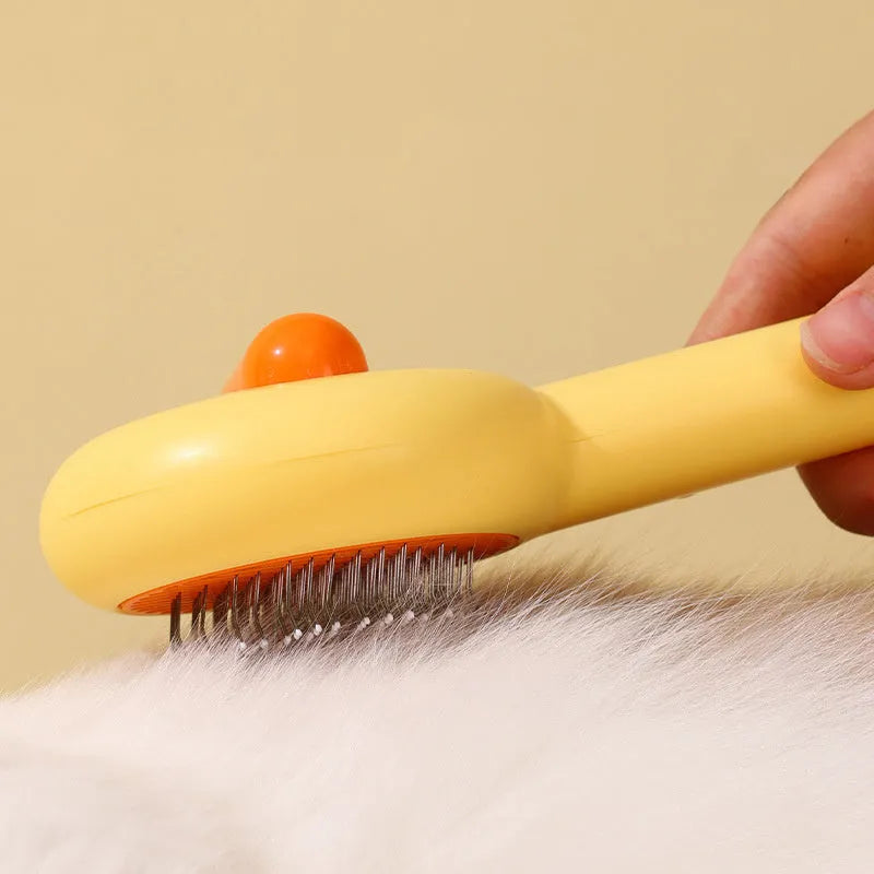 Small yellow duck comb brush for pet hair removal with open-section needle teeth