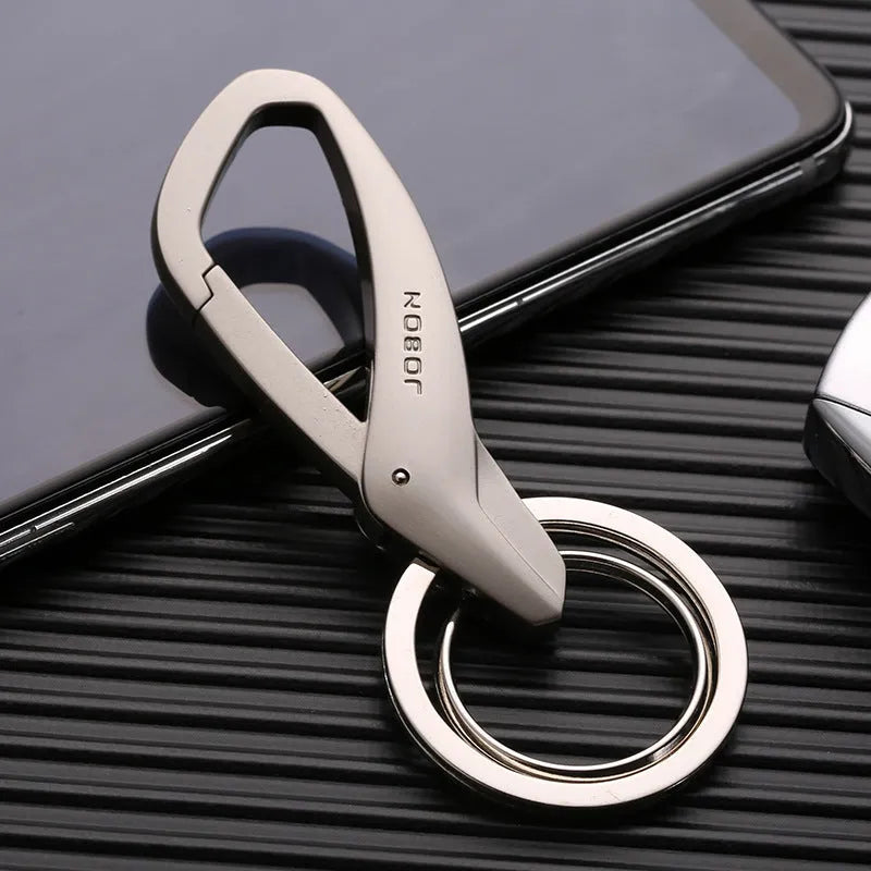 Simple double ring metal keychain in zinc alloy, shown in black, chrome, and nickel colour options.