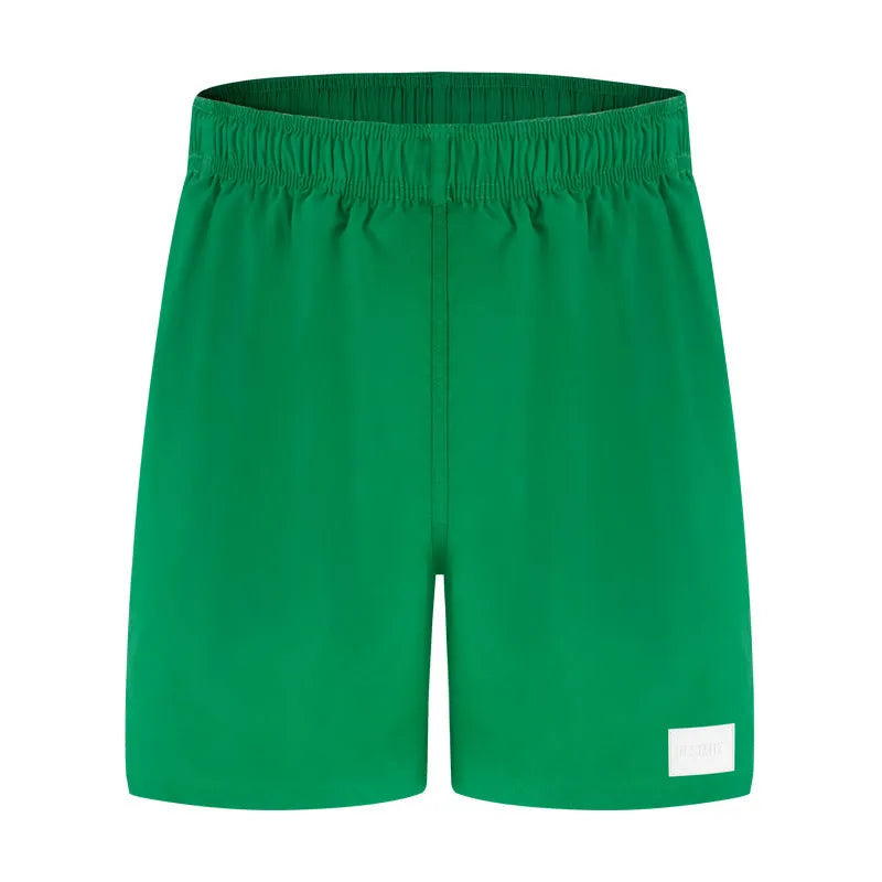 Men's quick-drying nylon sports shorts with straight leg opening in solid colours