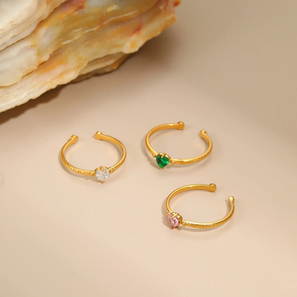 Adjustable open-ended stainless steel ring with heart-shaped zircon design in three colour options