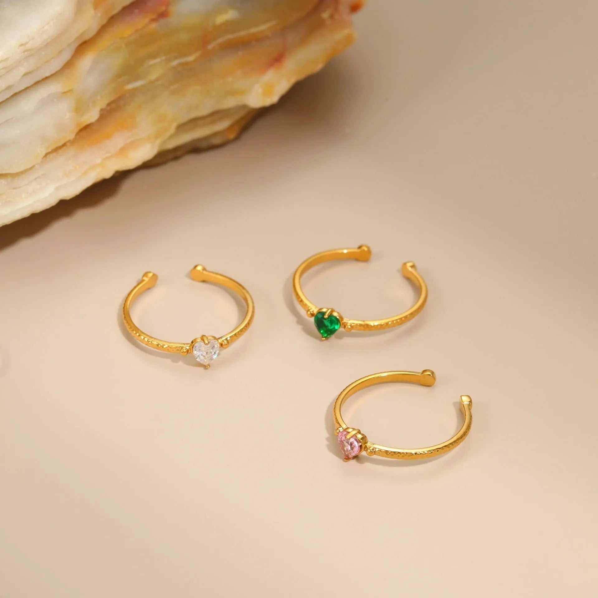 Adjustable open-ended stainless steel ring with heart-shaped zircon design in three colour options