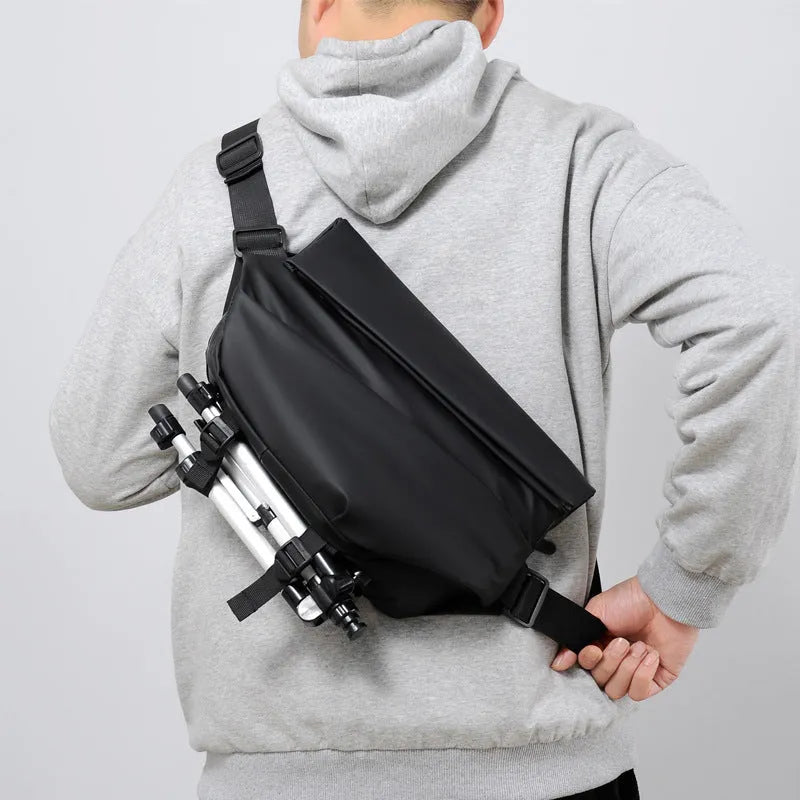 Men's grey PU crossbody bag with shoulder strap showing internal organisation compartments