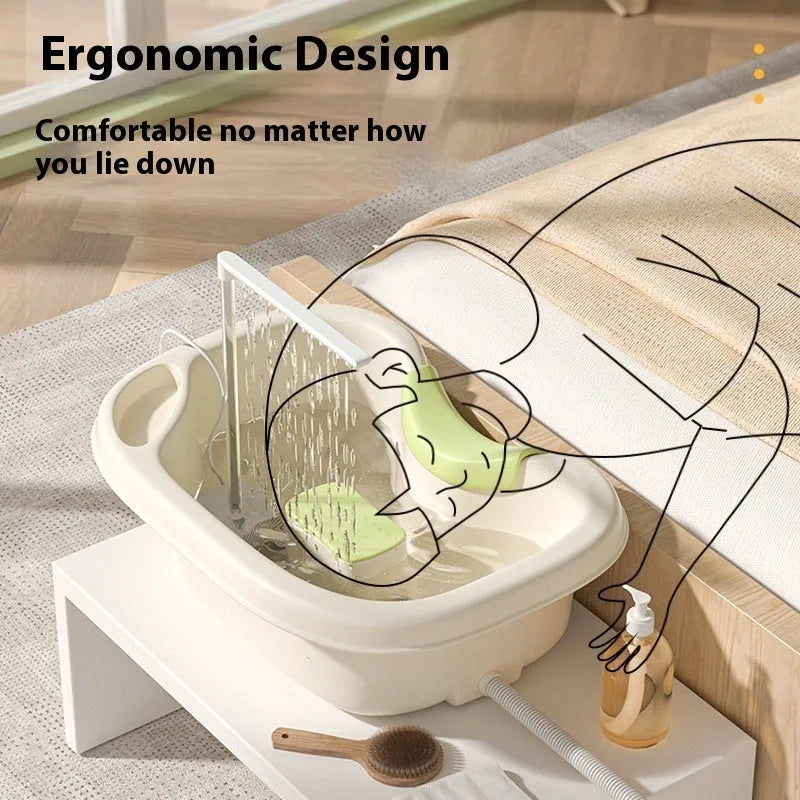 Portable plastic shampoo basin set with neck pillow, water pump, pipe, and brush in light pink and beige.