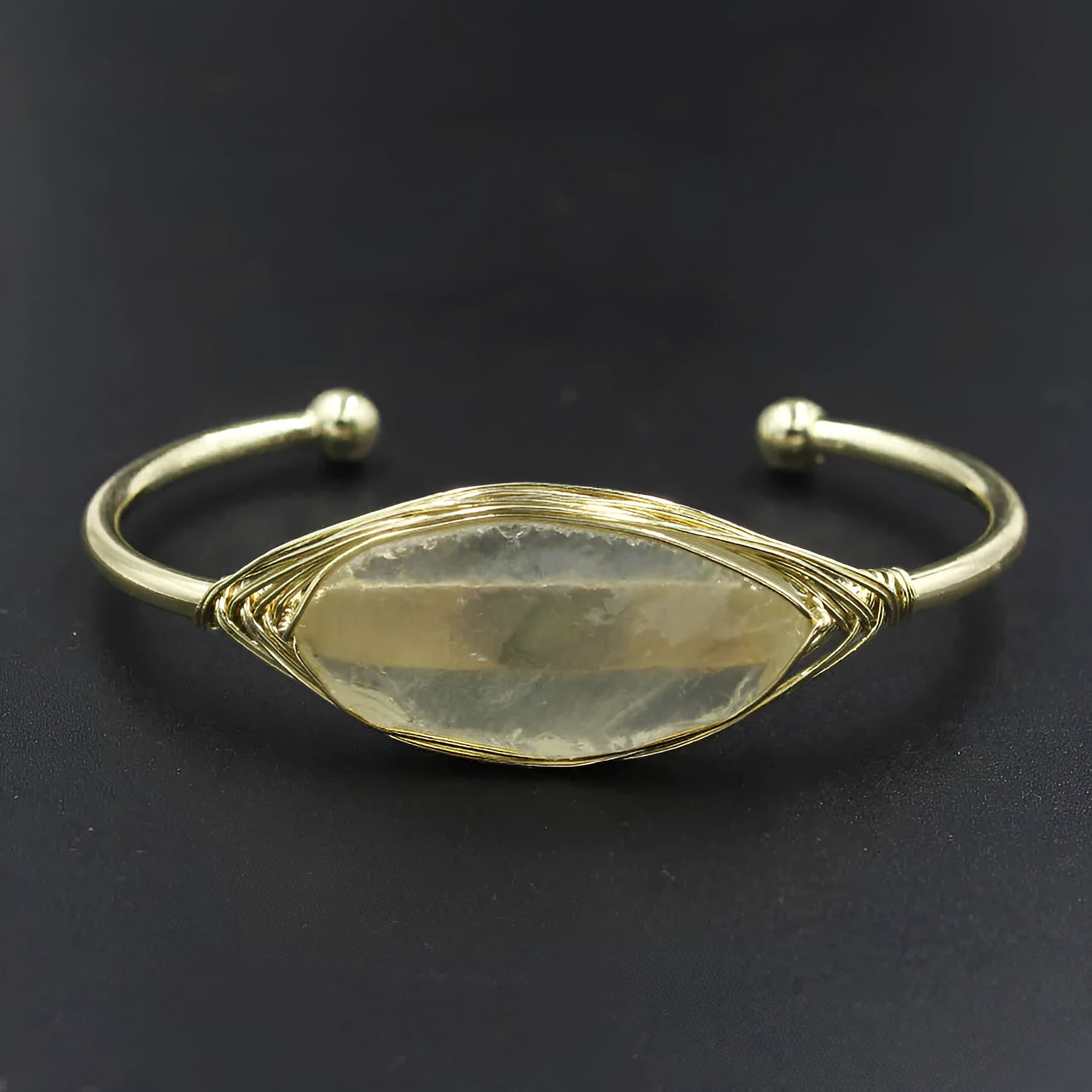 Natural raw gemstone winding crystal bracelet showing simple opening design and amorphous 8mm shape