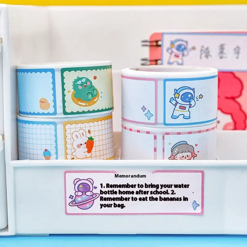 Roll of colourful cartoon name stickers showing dinosaur, astronaut, rabbit, and girl designs for labelling