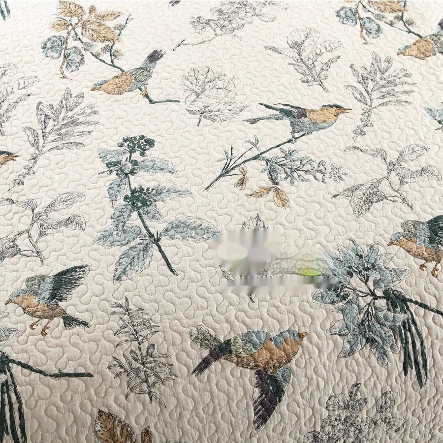 American style quilted cotton bed cover set with matching pillowcases on bed