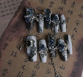 Blue night nail armour with ornate rose and tulip floral patterns in plastic evening manicure set