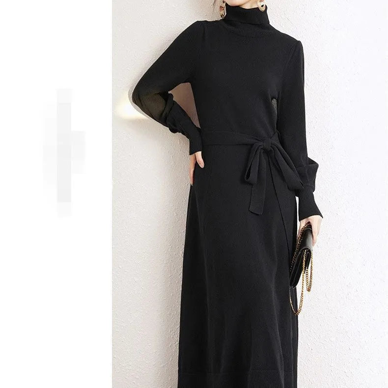 A rose red knitted turtleneck dress with long sleeves, an elastic waist, and a loose mid-length skirt.