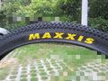 Ultralight puncture-proof mountain bike tyre showing tread pattern and available size options