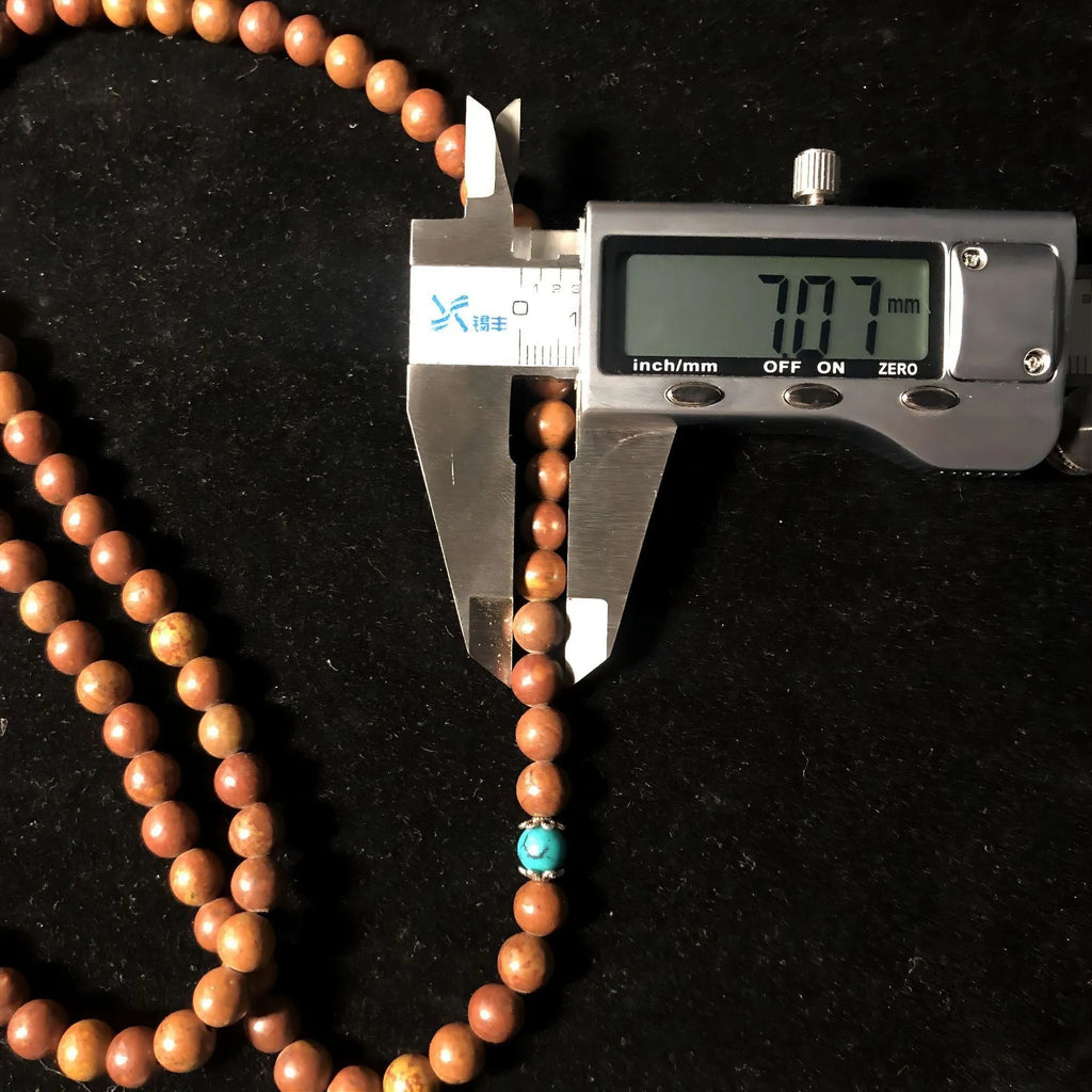 Handmade geometric stone bead bracelet with 108 Lvzhu beads measuring 5-6mm diameter