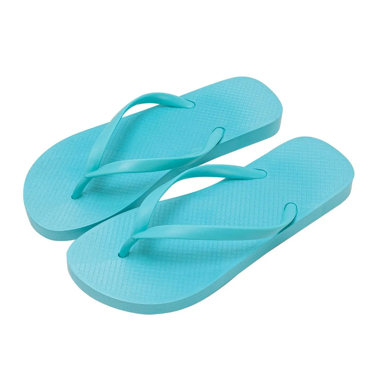 Orange foldable beach slippers with hollow-out design and non-slip PVC soles on a sandy background.
