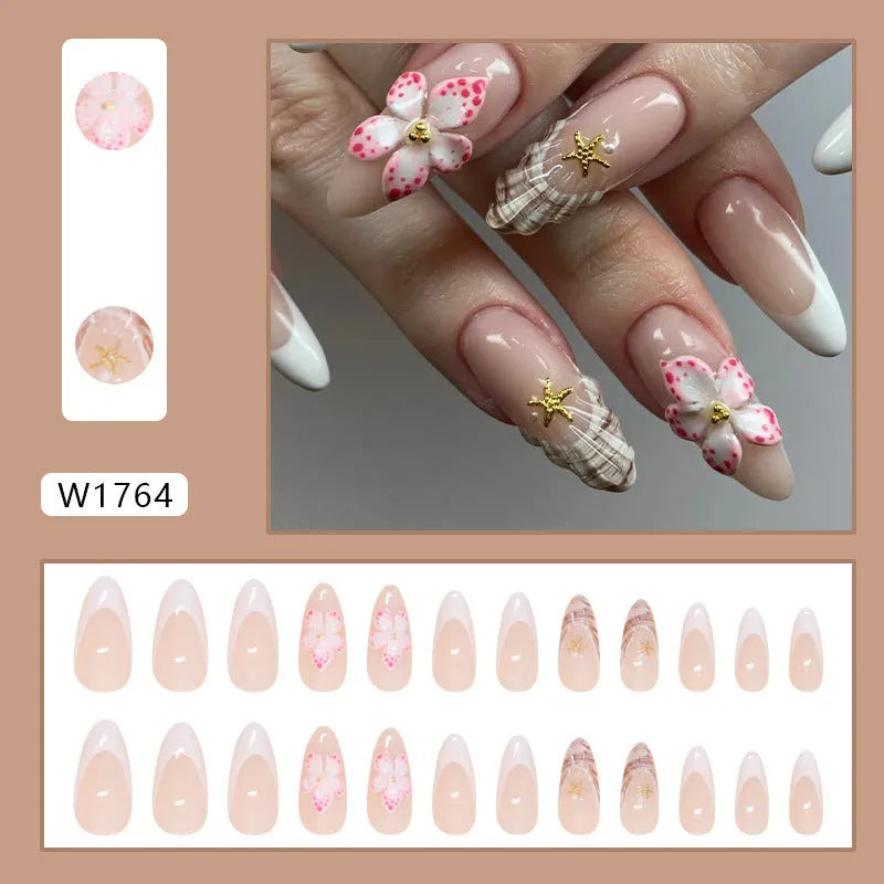 W1764 Simple Flower French style false nails with rock pattern patch on plastic tray.