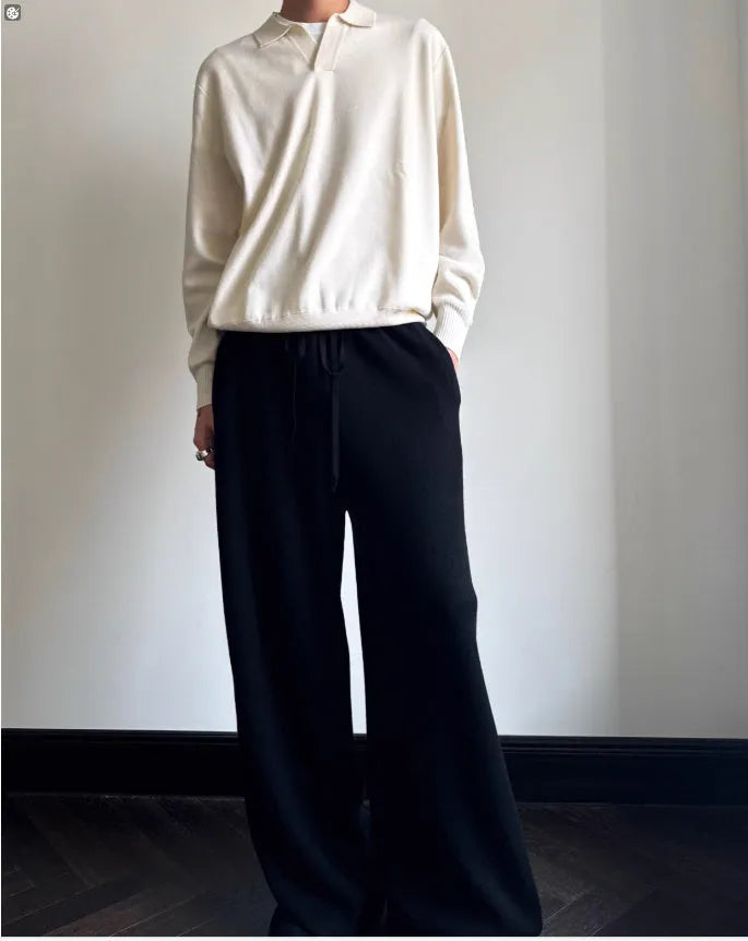 Man wearing a milky white pure wool lapel collar polo sweater with loose fit