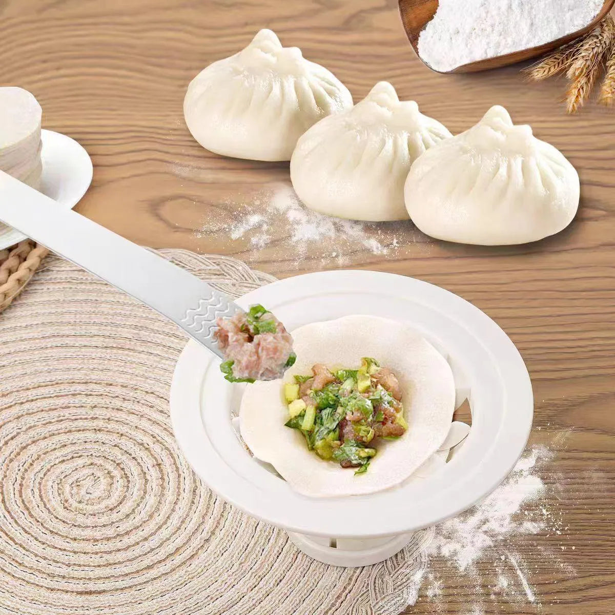 Black handheld steamed bun and dumpling mould for shaping Asian pastries.