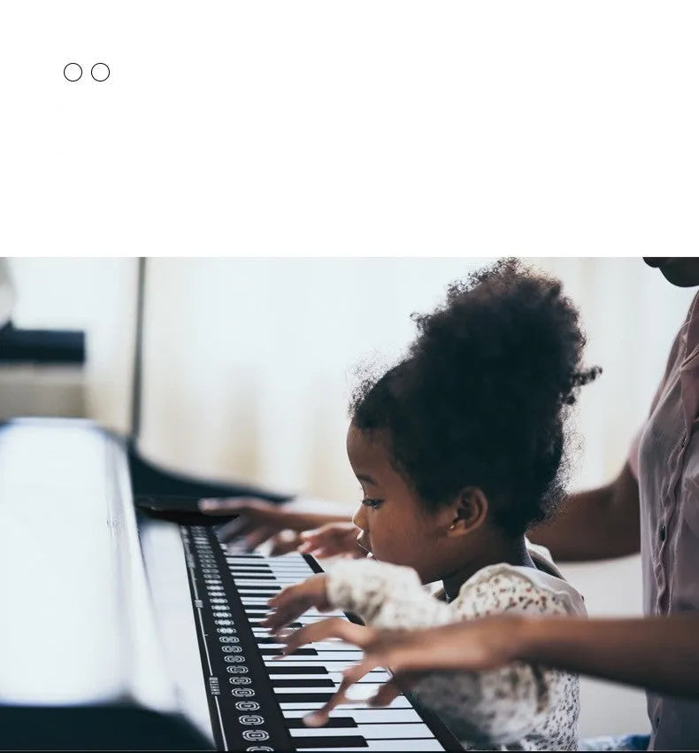 Portable folding 49-key electronic keyboard shown in Pearl White colour with folded compact size